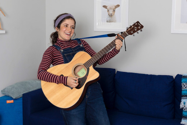 Lisa Stockman holding a guitar.