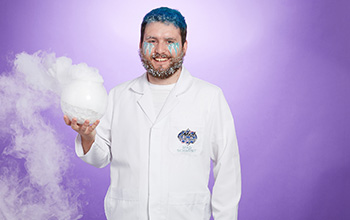 Man holding dry ice experiment.
