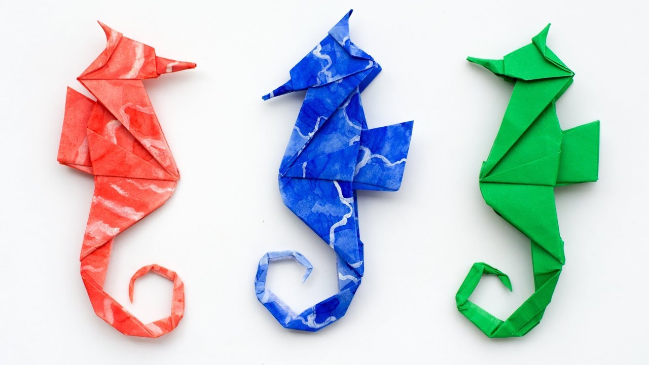 Origami made seahorses in red, blue and green