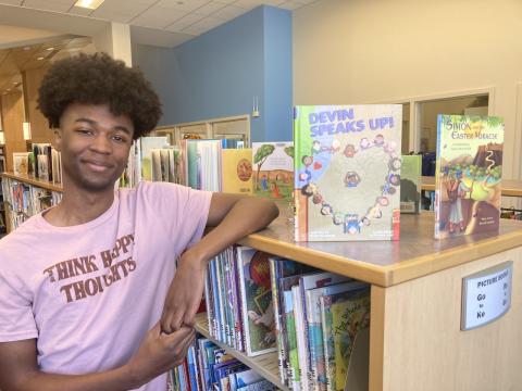 Devin Moore with his book Devin Speaks Up!