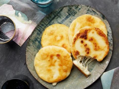 4 cheese arepas on a plates
