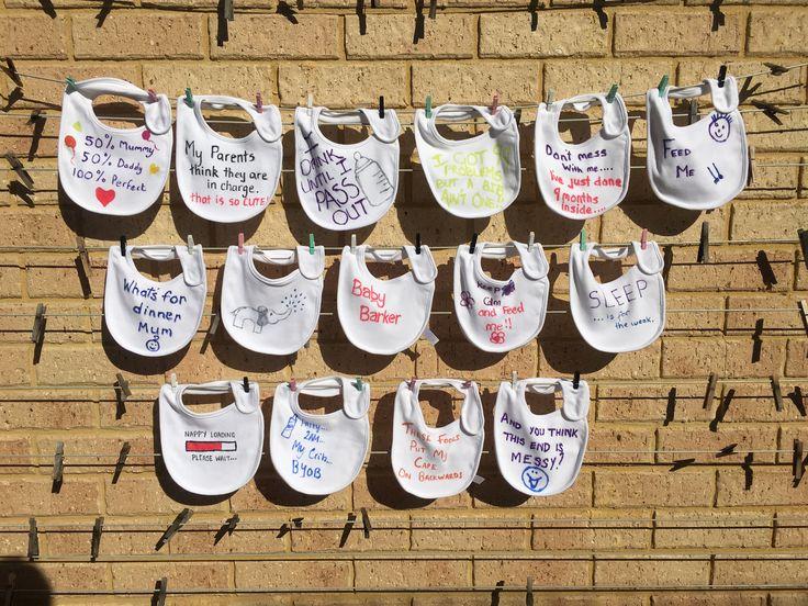 Self design baby bibs hanging on a clothesline